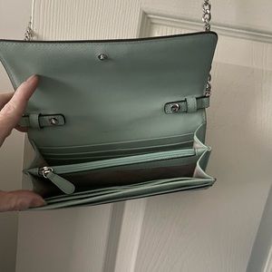 Michael Kors wallet with strap. Used one time. Mint green in color.
